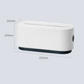 Blue and white power strip storage box with lid open showing cable holes and phone slot.