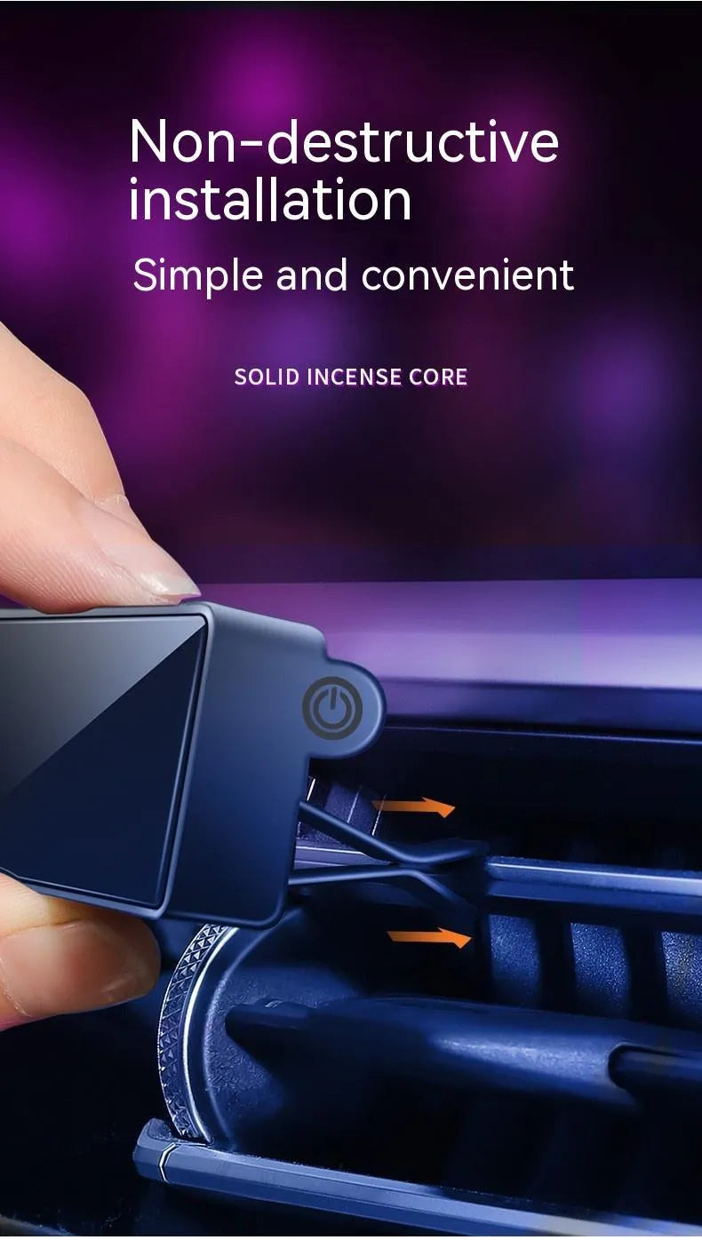 Black car air vent perfume diffuser with LED light attached to dashboard vent
