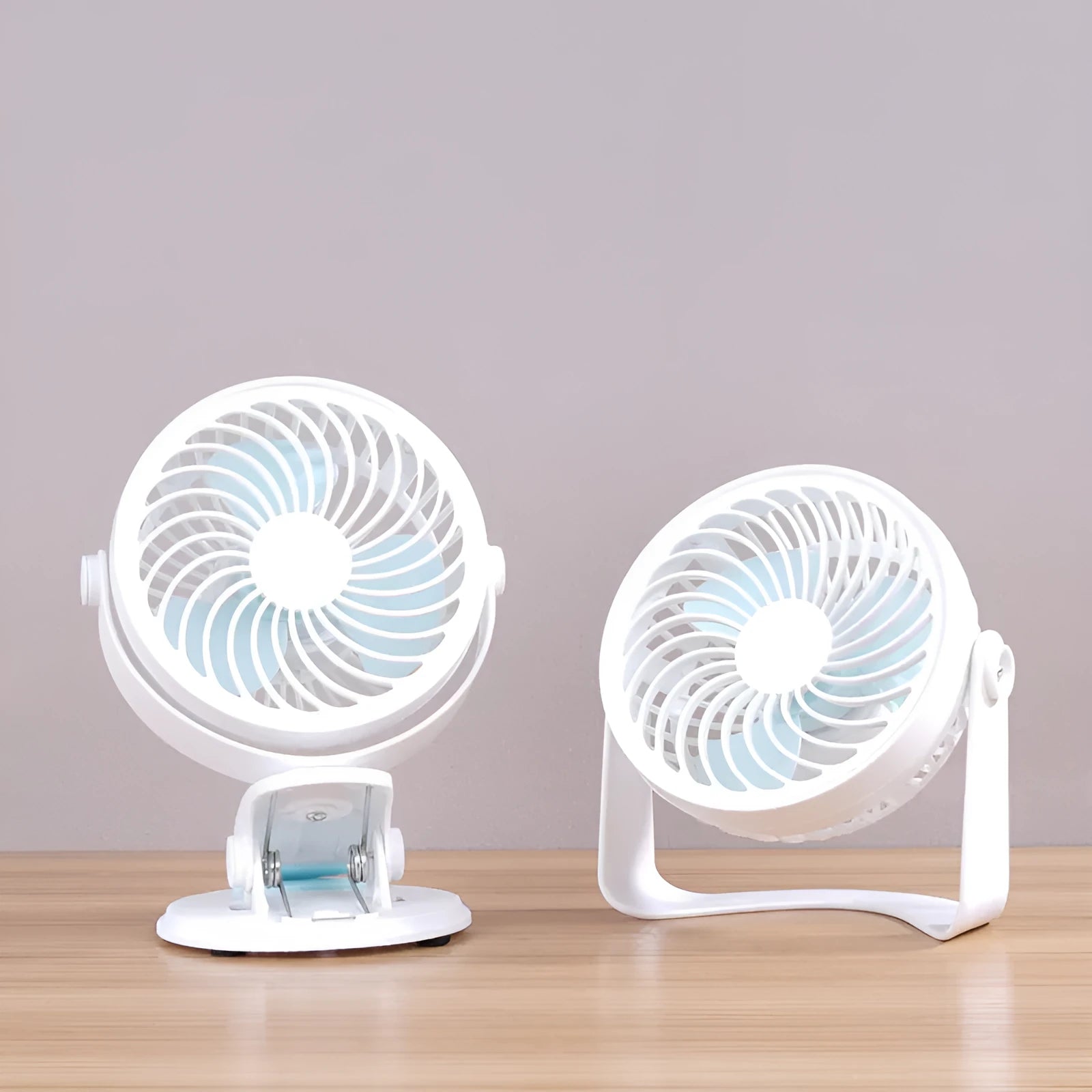 Small USB desktop fan in clip and floor standing styles showing compact size and three blades