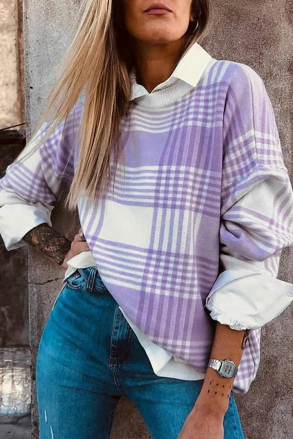 Lilac and white plaid print loose sweater with long sleeves and ribbed trim on cuffs and hem.