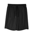 Man wearing loose black quick-dry polyester fitness shorts with an elastic waistband.