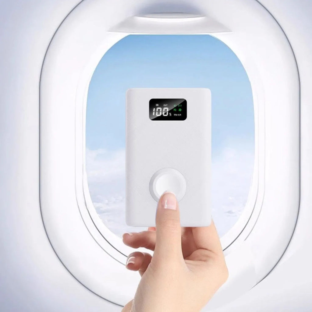 Black and white magnetic wireless power bank with digital display showing battery percentage