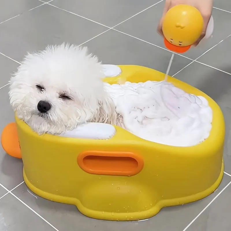 Blue duck-shaped PVC bath tub for washing dogs and cats on a patio.