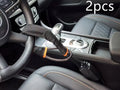 Red iron car steering wheel lock with wire rope, shown on a GM vehicle steering wheel.