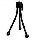 Small black iron mini tripod with ball head, shown collapsed to 110mm and extended on a desktop next to a smartphone.