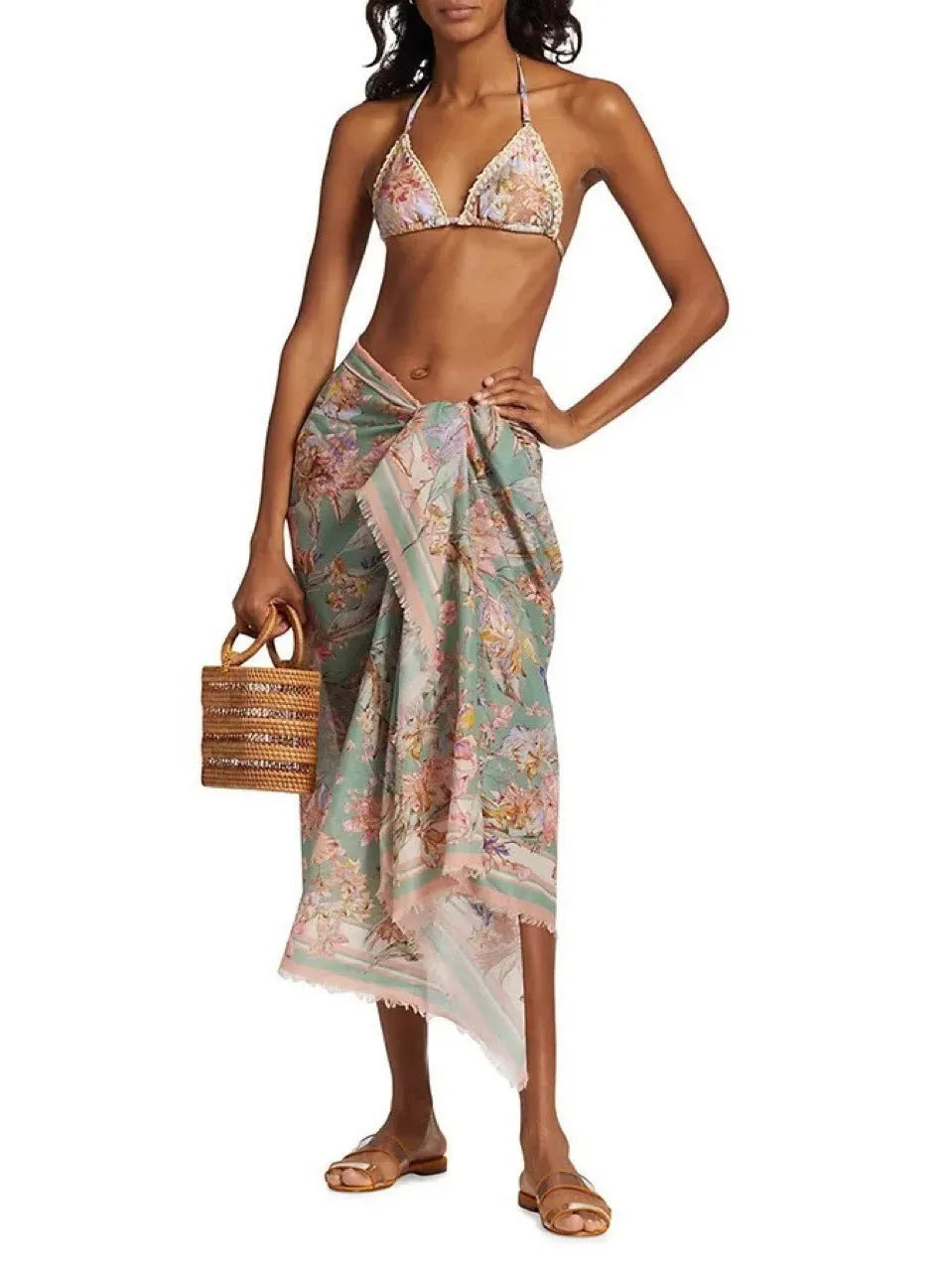 Creamy white floral print women's bikini set with attached skirt, showing top, briefs, and skirt components