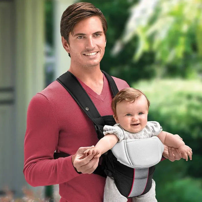 A double-shoulder baby carrier shown in red, blue, and grey, suitable for face-to-face infant carrying.