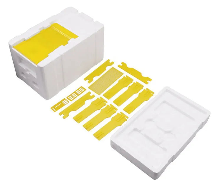 Three white EPS foam bee breeding boxes for hive mating and pollination.