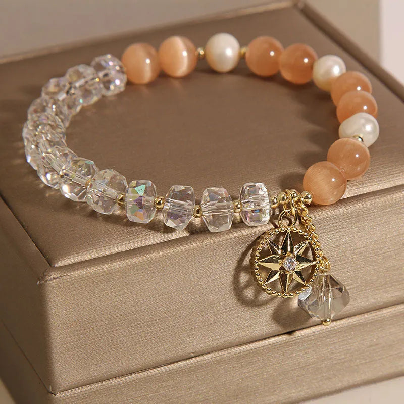 Gold-plated bracelet with eight Awn star motif and orange opal crystals