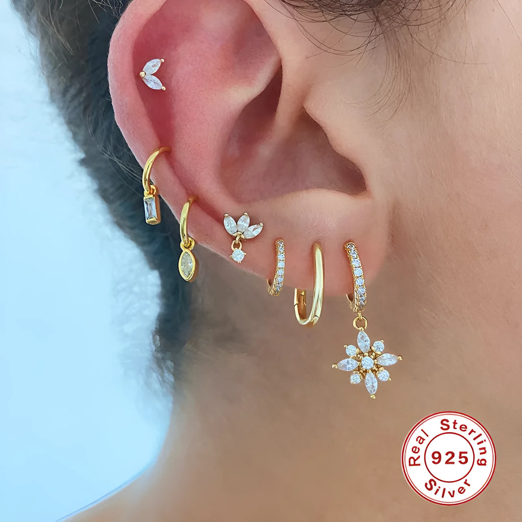 Sterling silver snowflake pendant earrings with diamond accents in geometric design