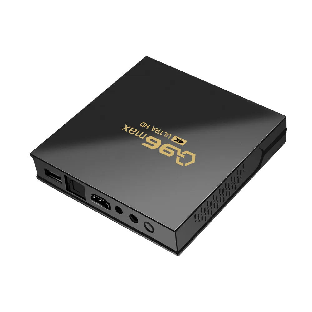 Q96 MAX S905 Android 4K TV set-top box with remote control and HDMI cable on a dark surface.