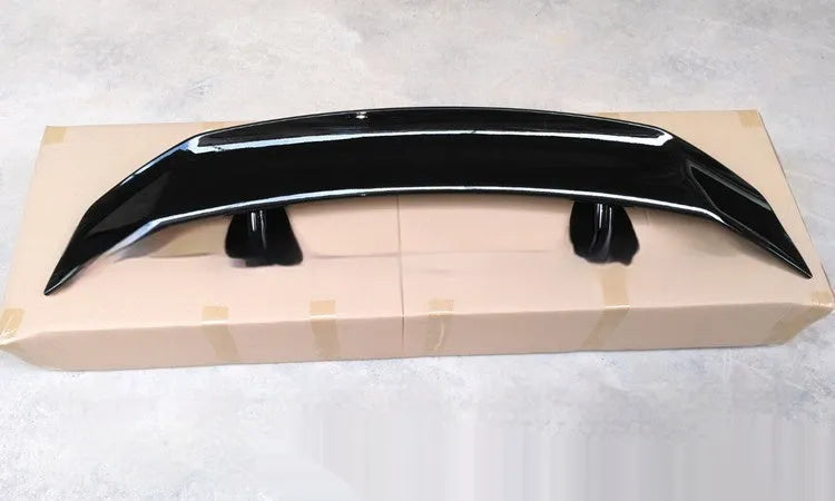 Universal punch-free ABS car spoiler in bright black, carbon, white, and blank finishes.