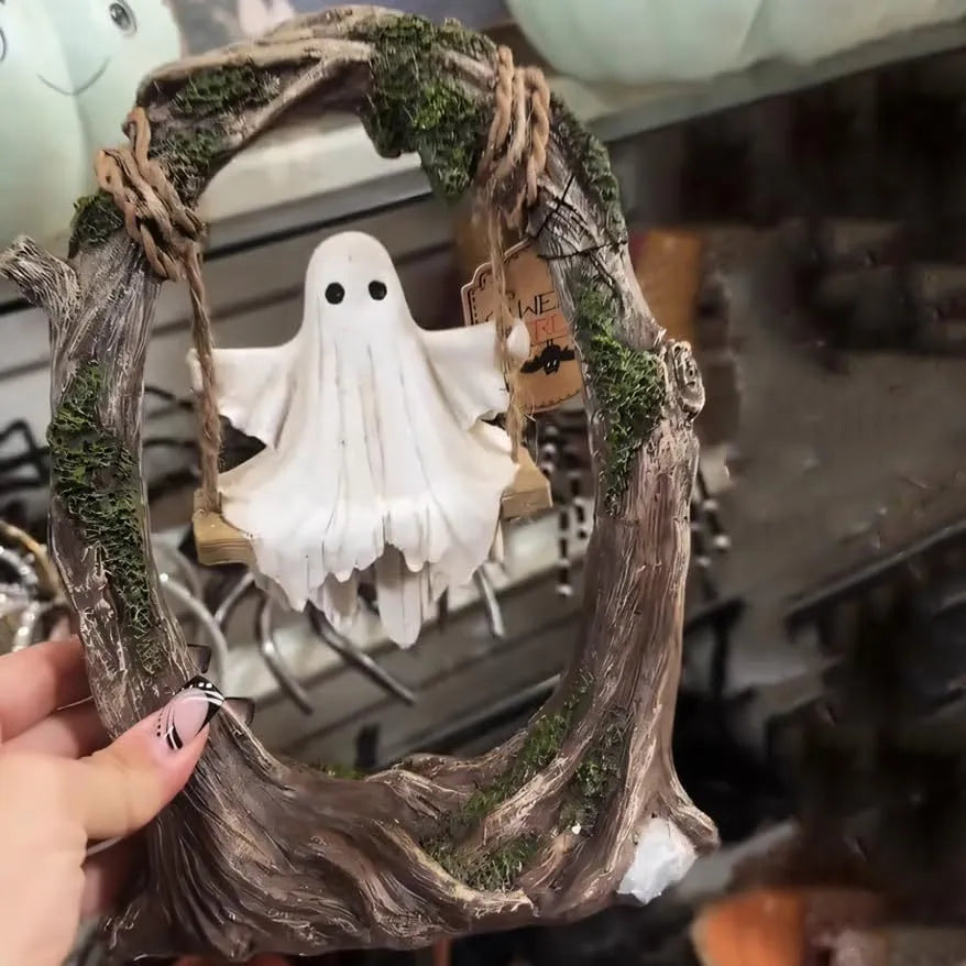 Grey resin Halloween ghost swing ornament with modern art design on display