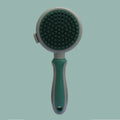Pink and green double-sided cat grooming brush with release button and separate flea comb