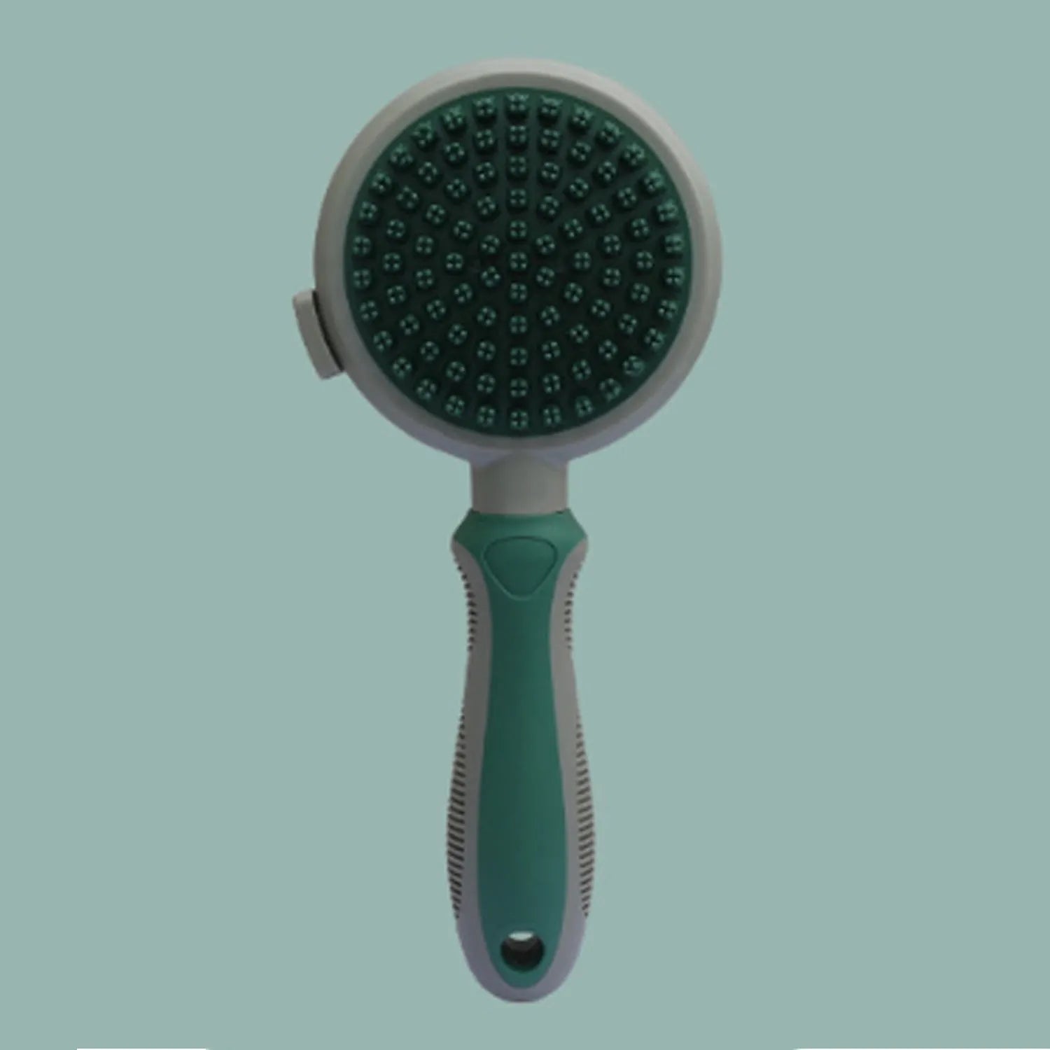 Pink and green double-sided cat grooming brush with release button and separate flea comb