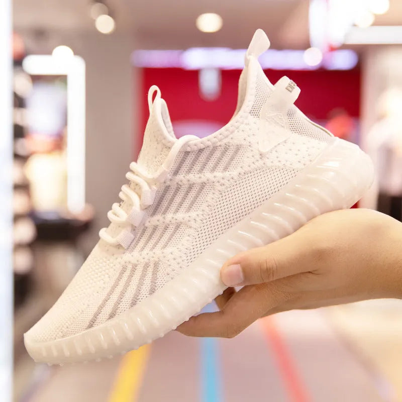 Men's white breathable flying fabric sports shoes with low-top platform design and round toe.