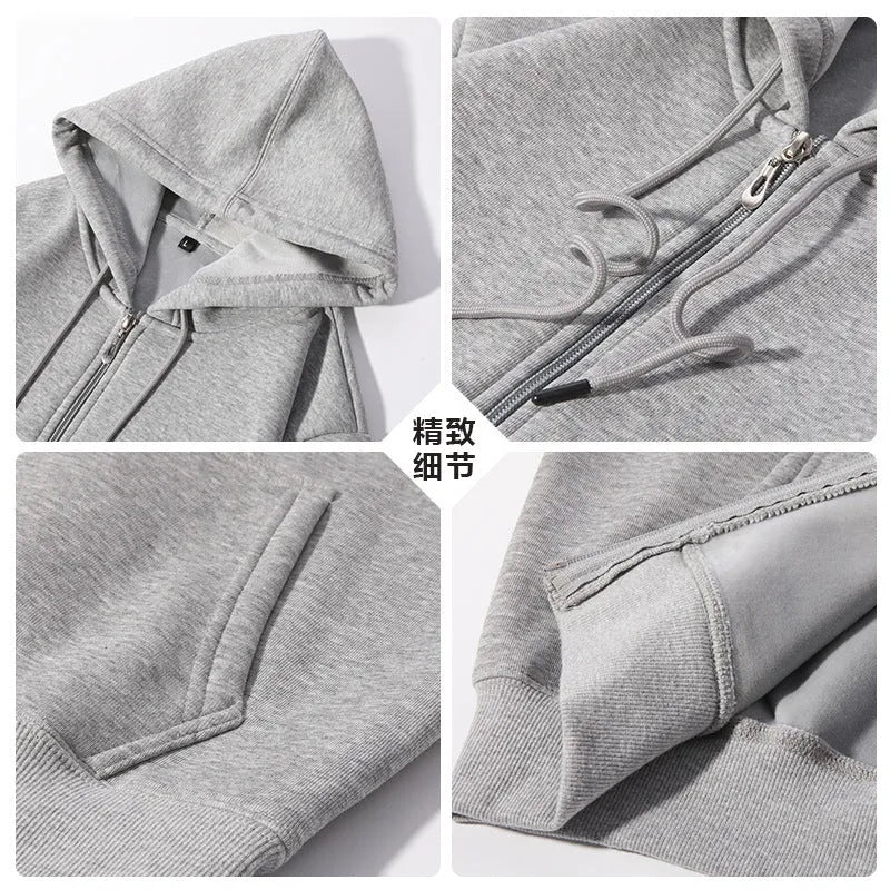 Man wearing a beige heavyweight zip-up hooded sweater, showing top-stitched pockets and loose fit.