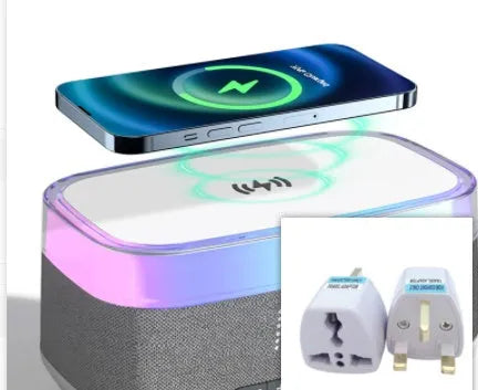 White alarm clock with wireless charging surface and Bluetooth speaker functionality for bedside use