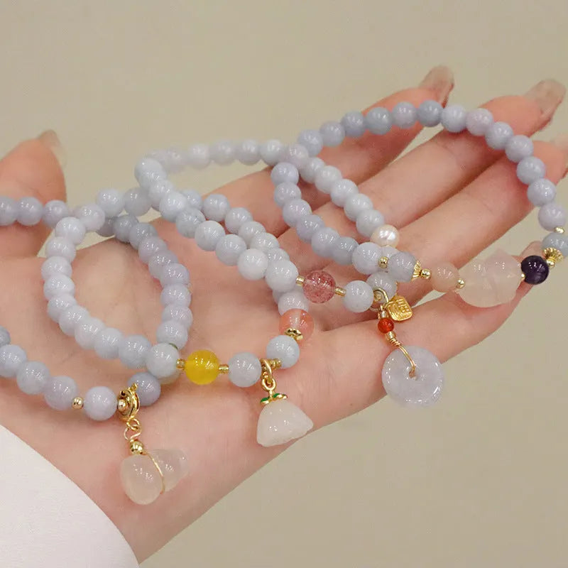 Aquamarine crystal bracelet with gold-plated climbing cat charm for women