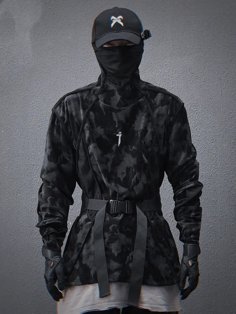 Man wearing a black tie dye print loose pullover sweater with drop-shoulder sleeves.