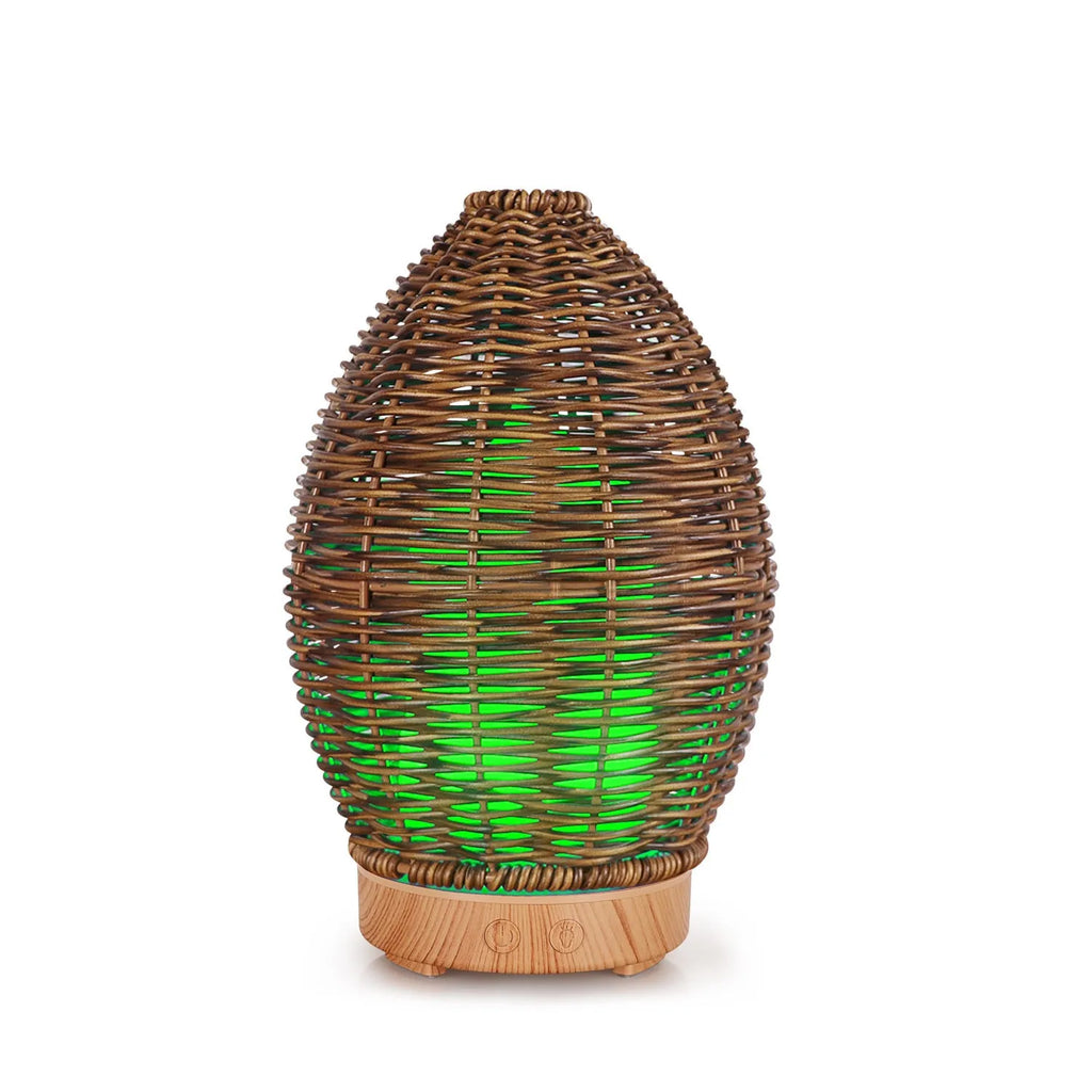 Hollow rattan design aroma diffuser with light wood grain base and 100ml capacity