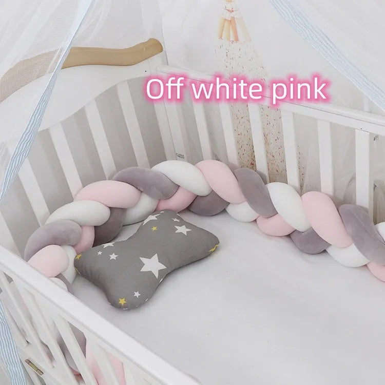Bendable braid knot baby crib bumper in spandex velvet fabric on a white cot.