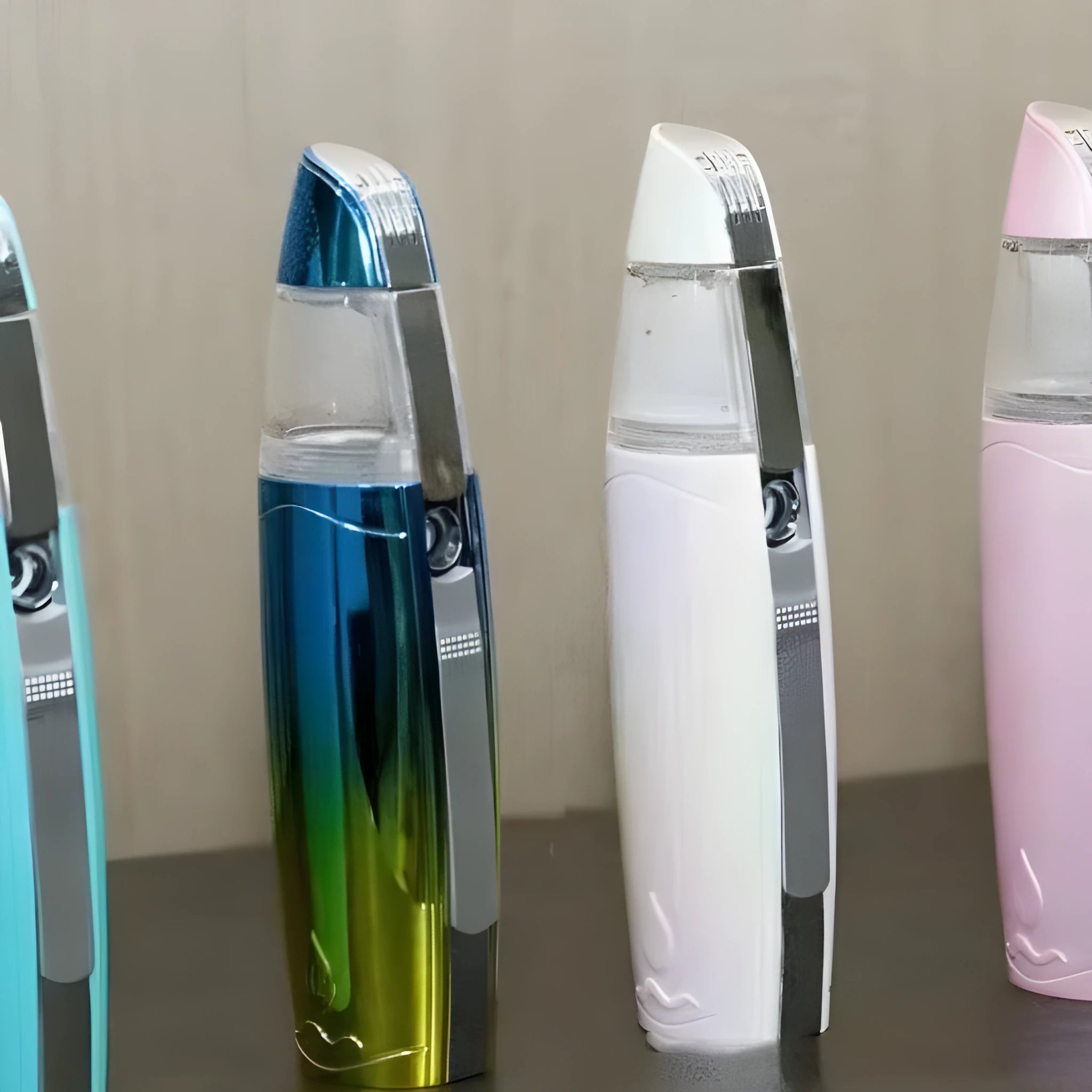 Peacock blue handheld USB rechargeable facial steamer for skin hydration.