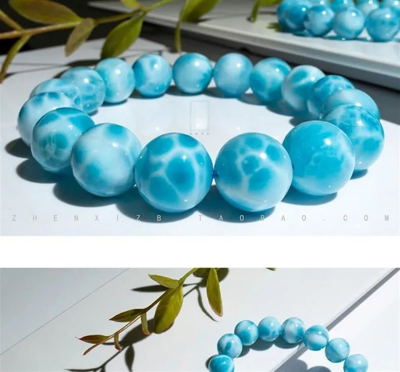 Blue Maillard style bodhi bracelet with natural crystal, sea-pattern stone, and pearls on a white background.
