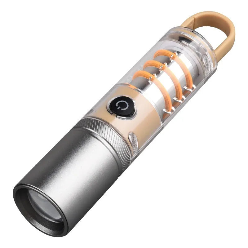 Orange and beige coloured multifunctional flashlight with keychain and optical zoom lens.