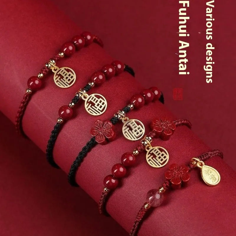 Cinnabar braided rope bracelet with blessing card, shown in black, red, or wine red with round bead or flower charm.