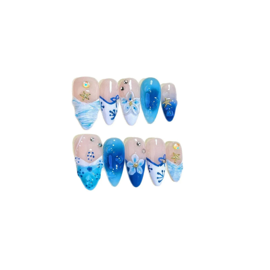 Blue hand-painted carved summer ice transparent plastic fake nails set showing carved detailing and four size options