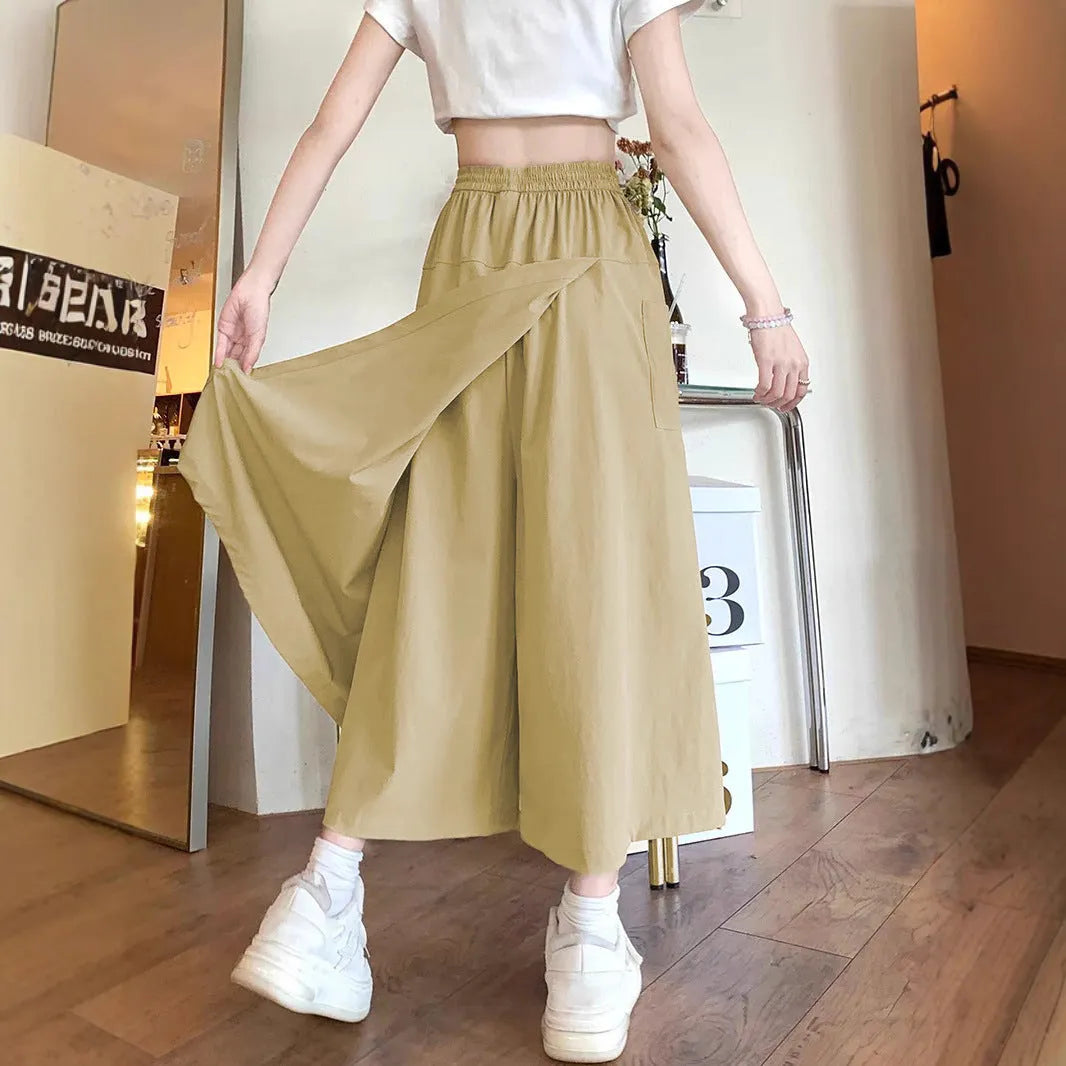 Camel-coloured women's wide leg skirt with elastic waistband, shown on hanger