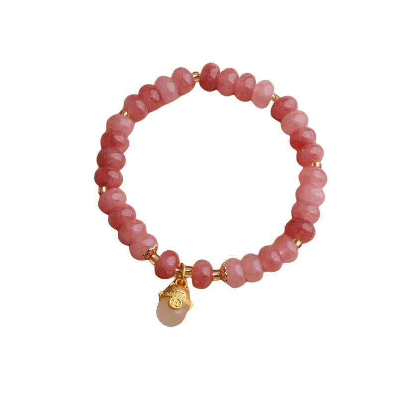 Women's strawberry quartz bracelet with a retro lucky cat charm in grey jade.