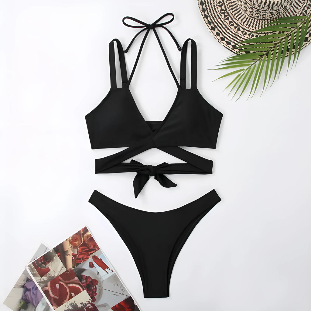 Women's solid colour strap bikini swimsuit in brief style on a white background.