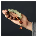 Wooden amass fortunes bracelet with carved Fu character design on rosewood