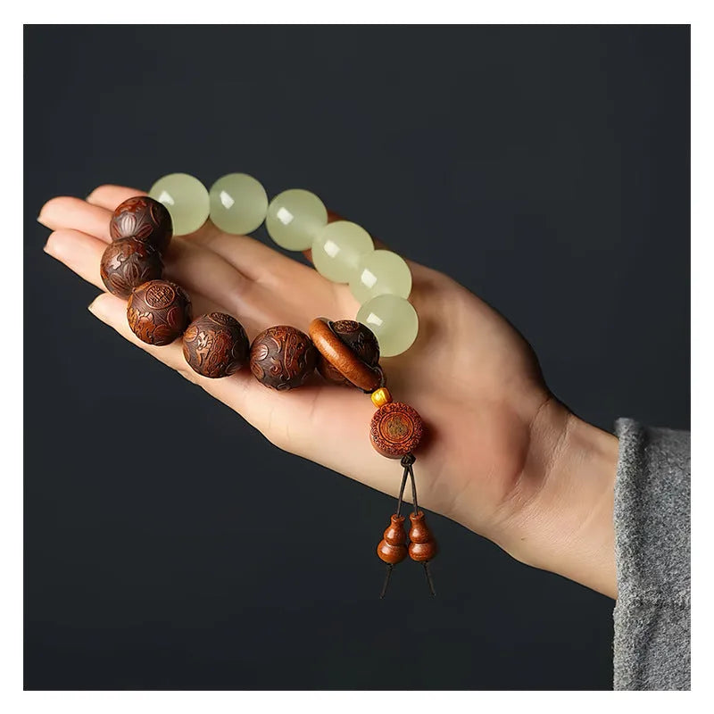 Wooden amass fortunes bracelet with carved Fu character design on rosewood