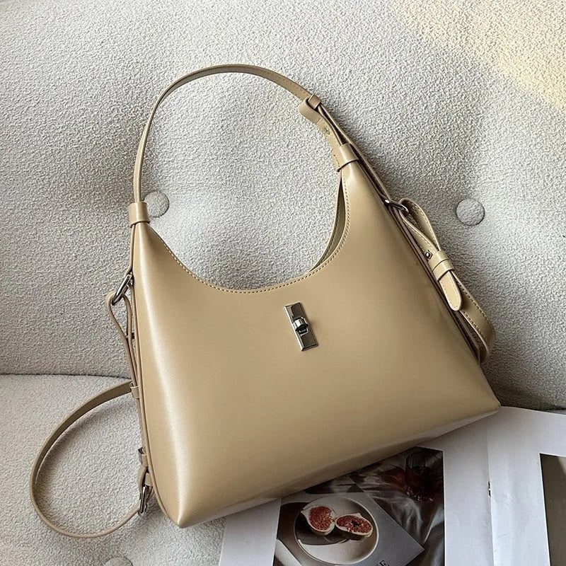 Genuine cowhide leather crossbody shoulder bag in dumpling shape with organised internal compartments