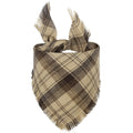 Classic plaid dog bandana with tasselled edges in autumn colours tied around dog's neck