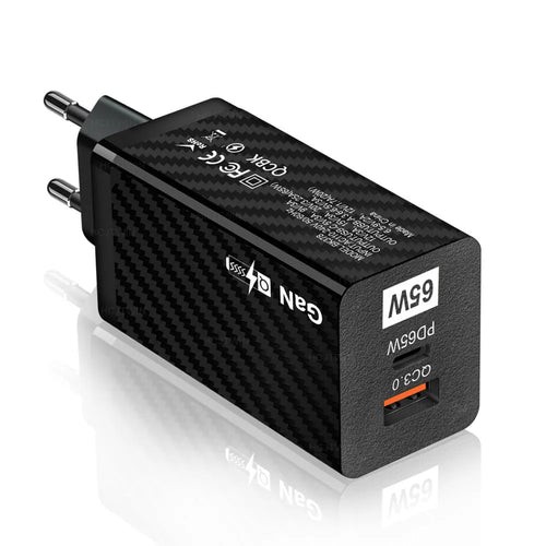 Compact white 65W Gallium Nitride laptop charger with USB-C port next to EU and US plug options.