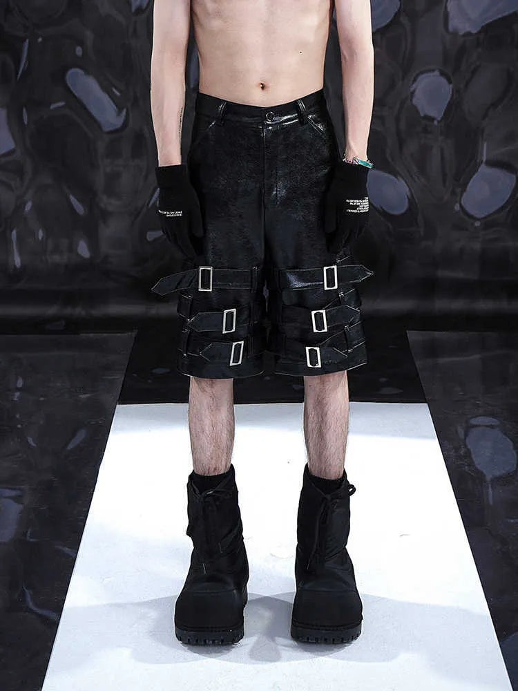 Men's black PU leather casual shorts with metal ring detail on a medium-low waistband.