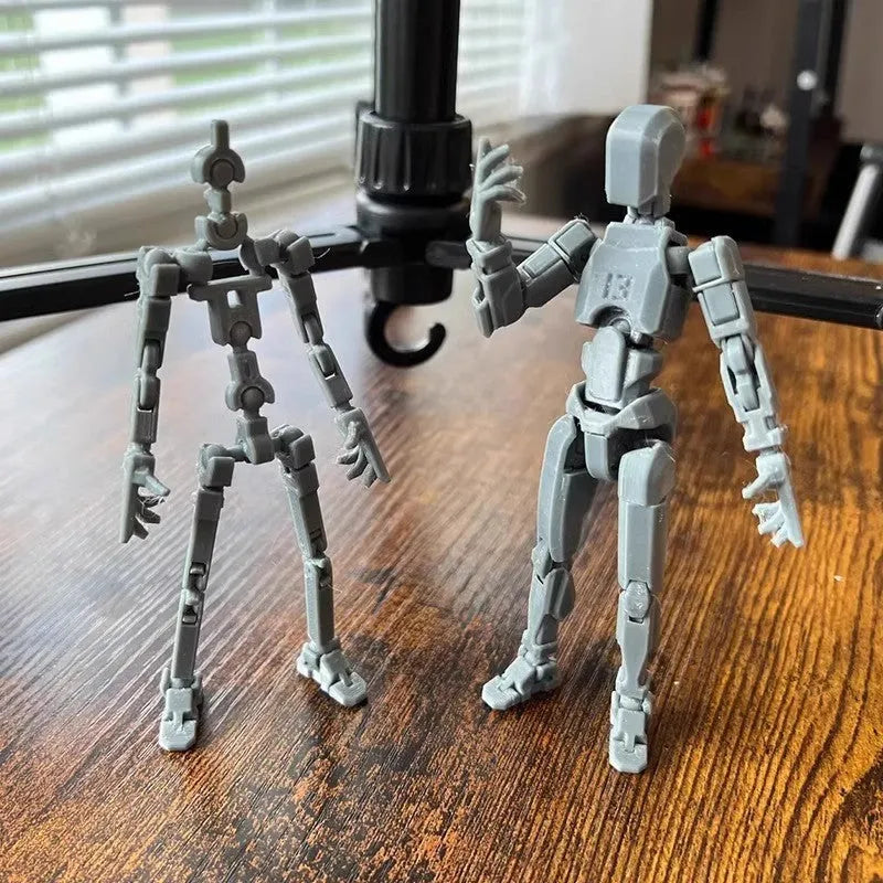 Unassembled 3D printed robot model kit with multi-jointed parts on a table
