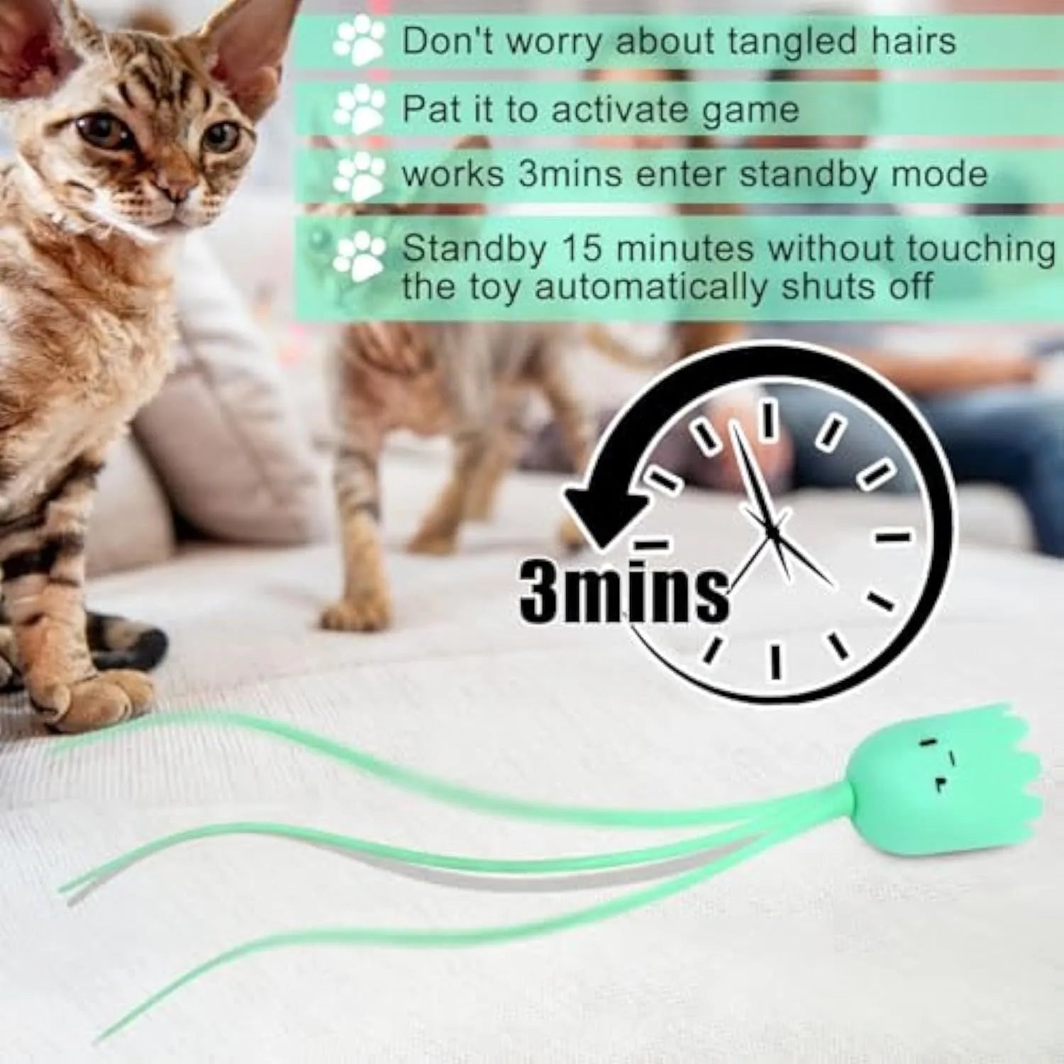 Green rechargeable automatic electronic cat wand toy with swinging silicone tail on a wooden floor