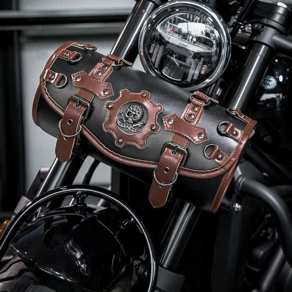 Black punk-style motorcycle pannier bag made from PU leather mounted on a bike.