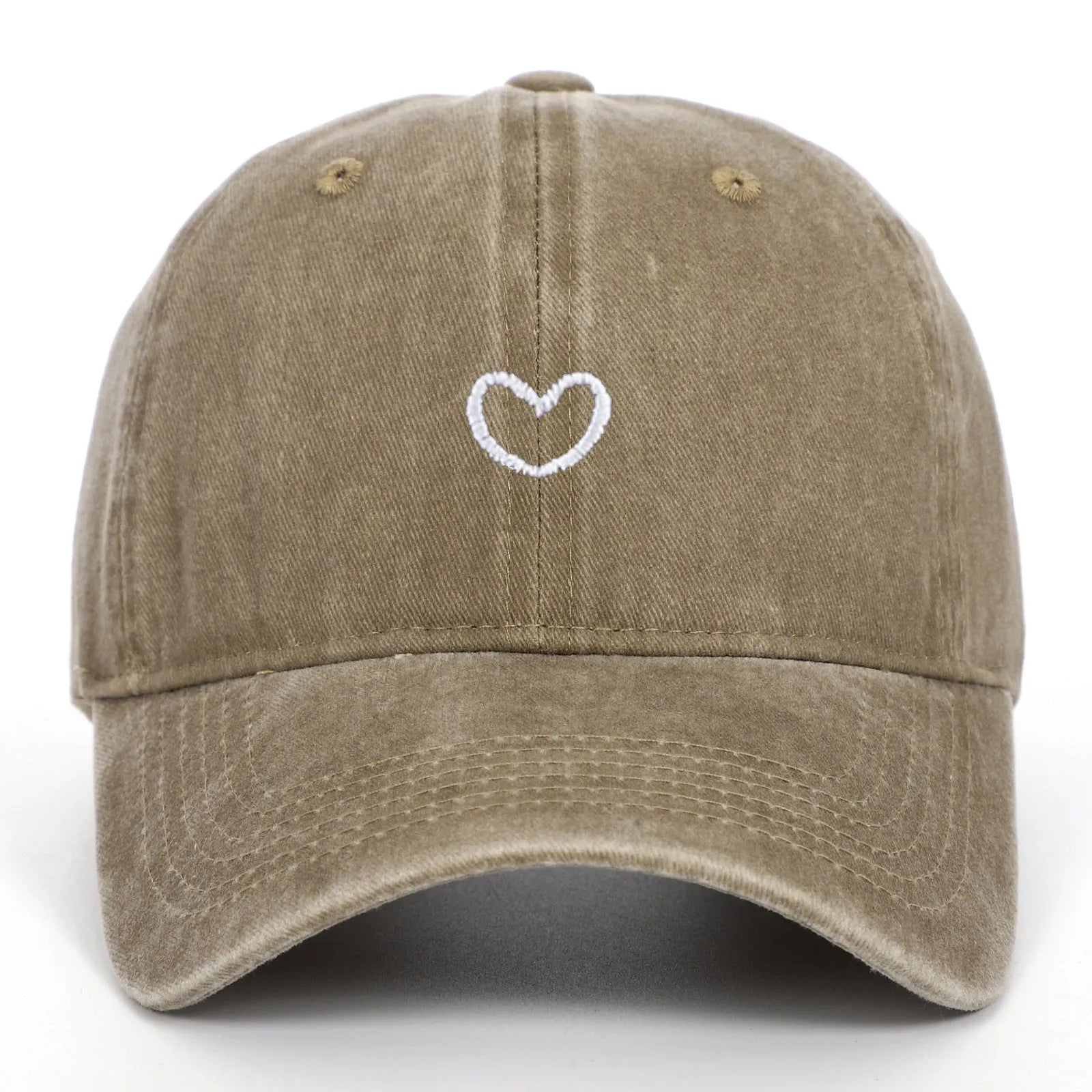 Adjustable cotton baseball cap featuring a distressed embroidered love heart on the front, shown in a selection of colours.