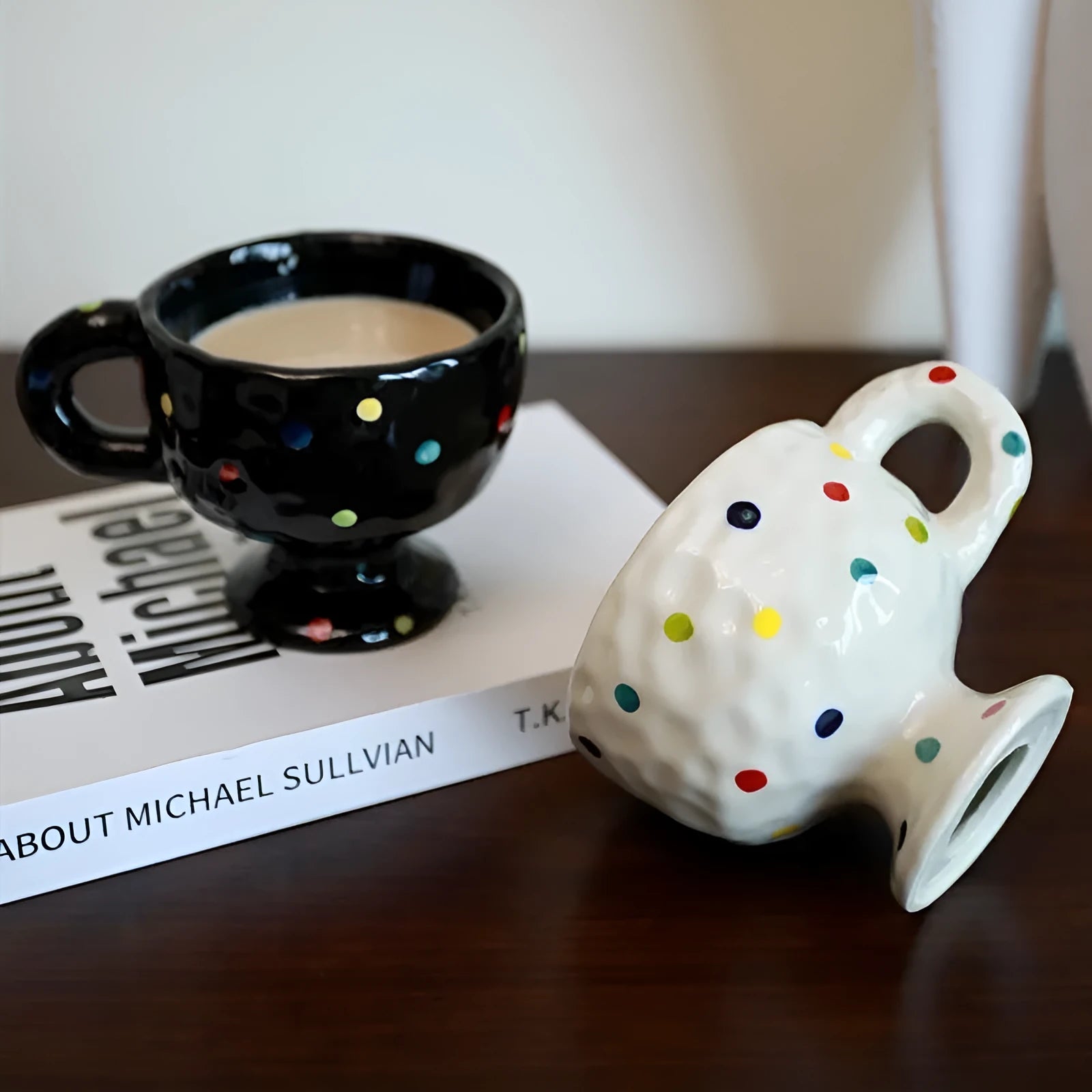Hand-pinched irregular ceramic mug in solid colour with modern simple design