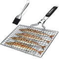 Square folding stainless steel wire barbecue mesh basket with a cleaning brush on a grill.