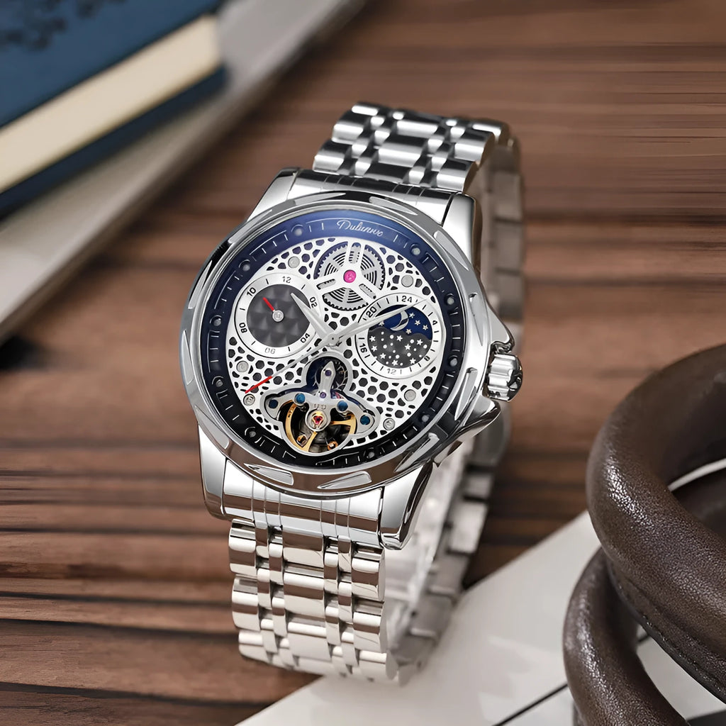 Men's automatic business watch with luminous hands on a steel bracelet, showing a black dial.
