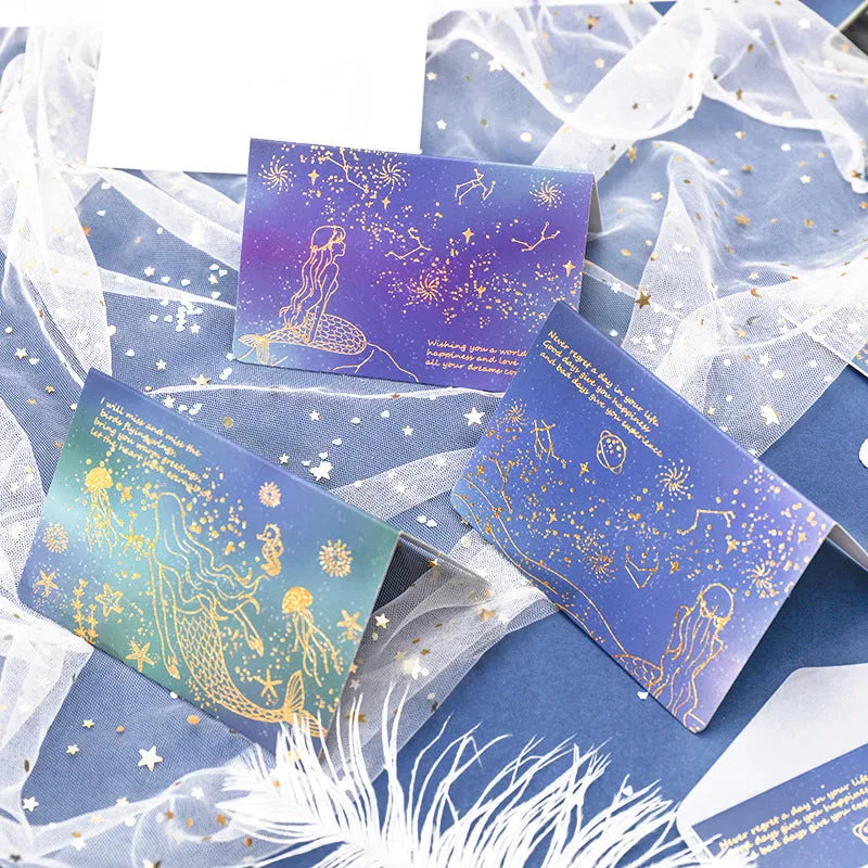 Set of three bronzing finish folding greeting card envelopes in four colour styles, measuring 13cm by 8.5cm.