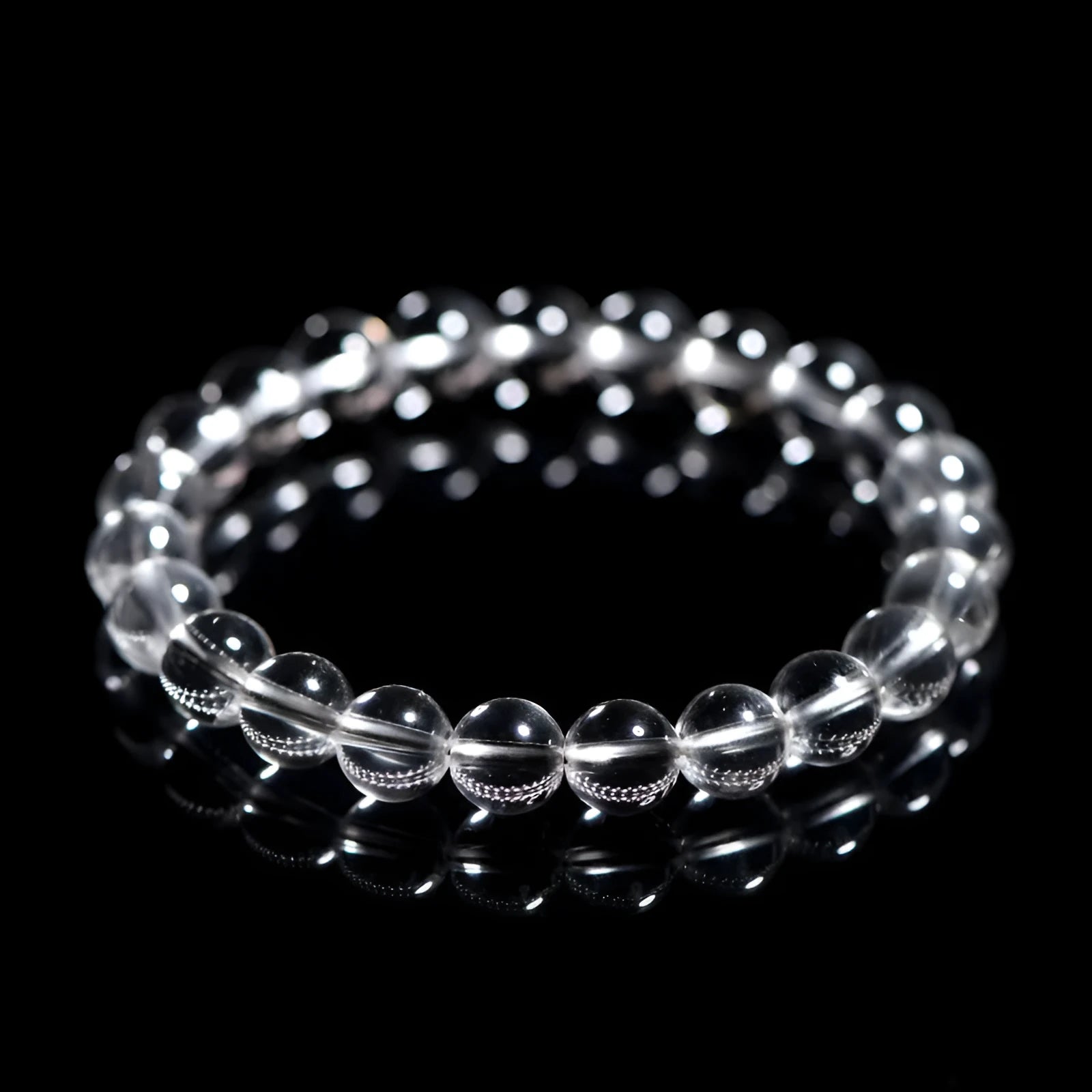 Natural old mine white crystal round bead bracelet from Donghai materials on a wrist, showing geometric design.