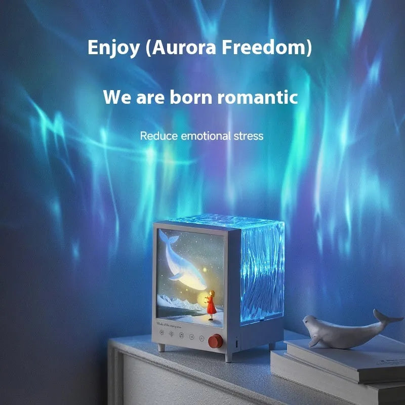 Aurora Treasure Box Star Sea Whale atmosphere projection lamp with Bluetooth speaker on a table.